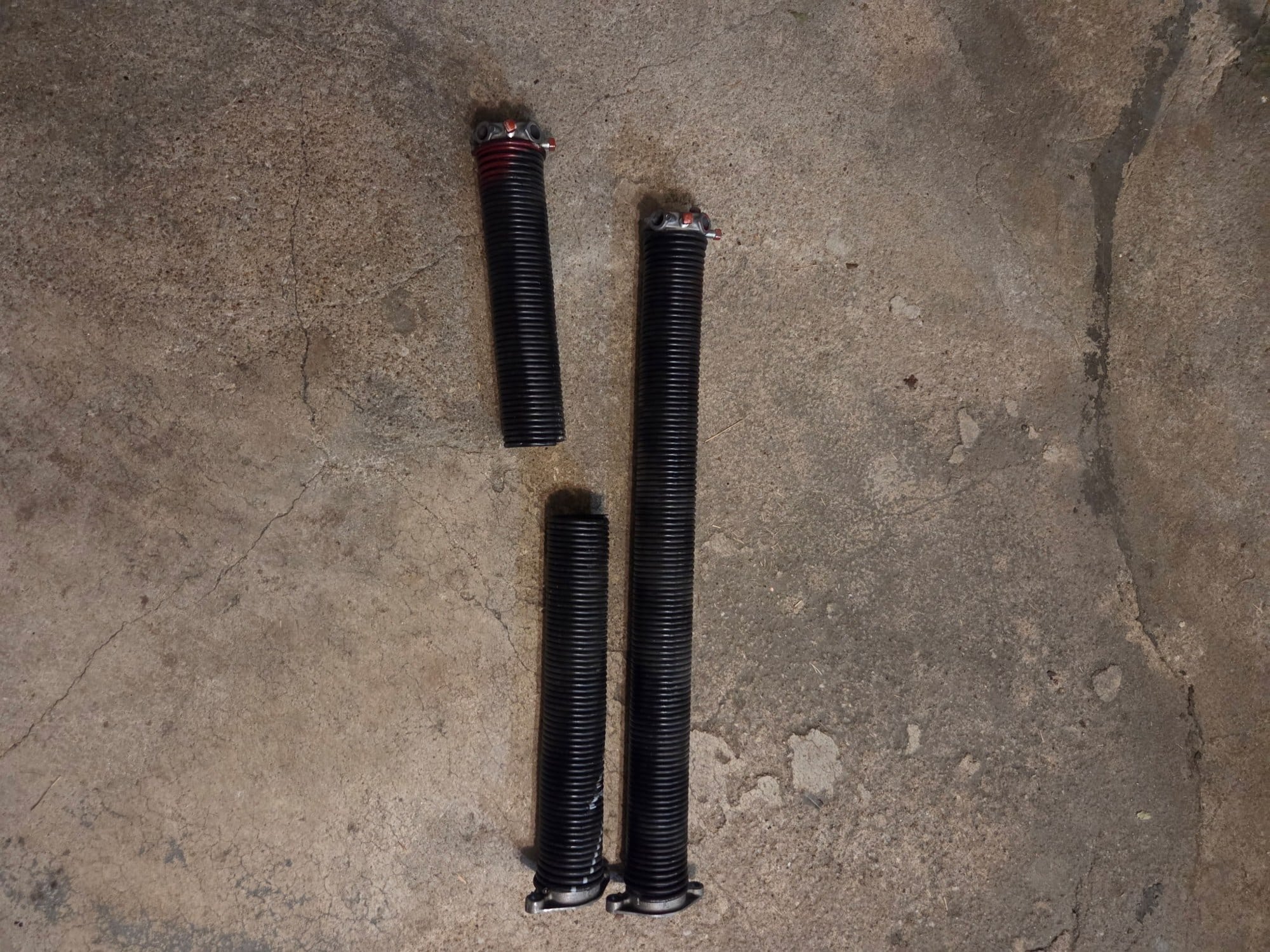 Broken torsion springs removed from a garage door