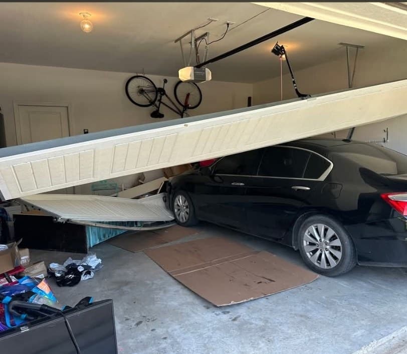 A garage door that came down on a car, an emergency call for Arrowhead Door Co